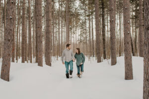 Married couple enjoys snowy winter maternity session in Houghton Michigan