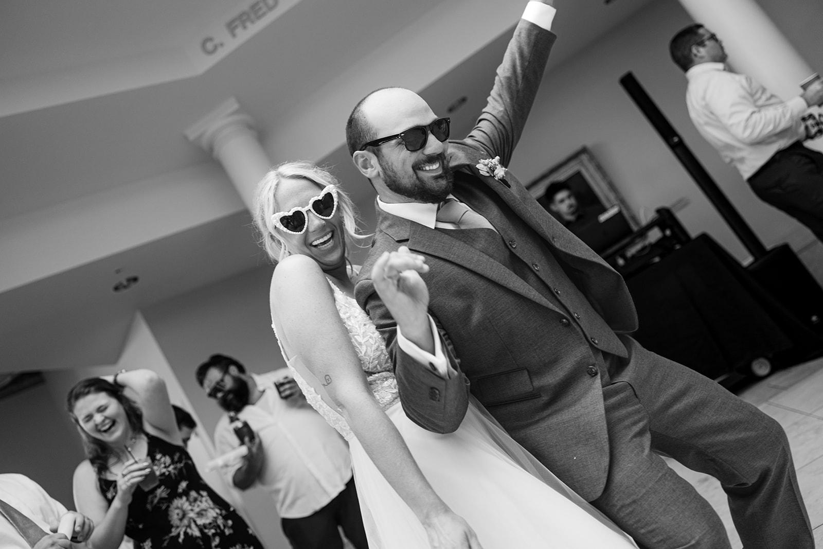 Married couple celebrate their wedding day on the dance floor during their summer wedding in Marquette Michigan